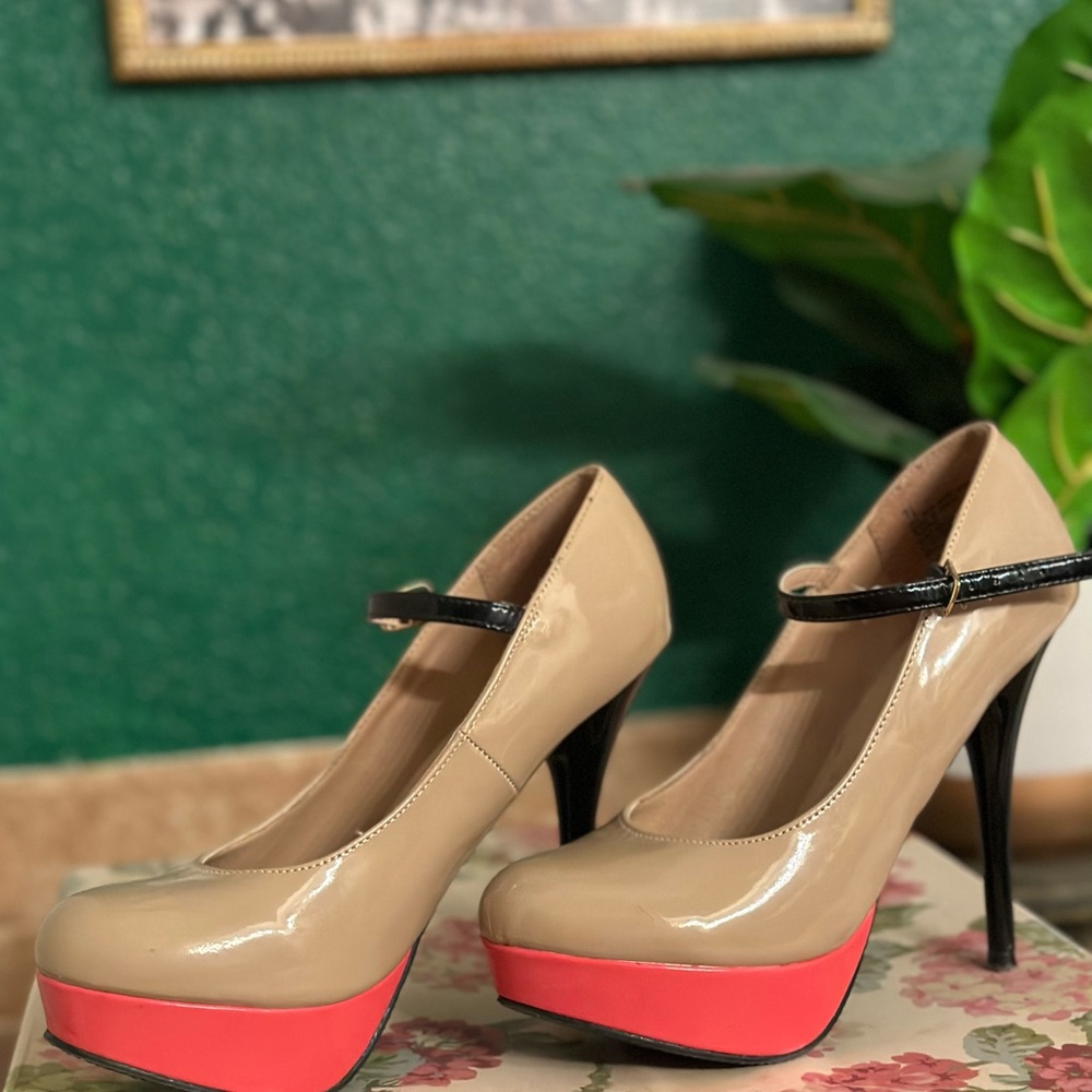 Tan and pink pumps with black strap